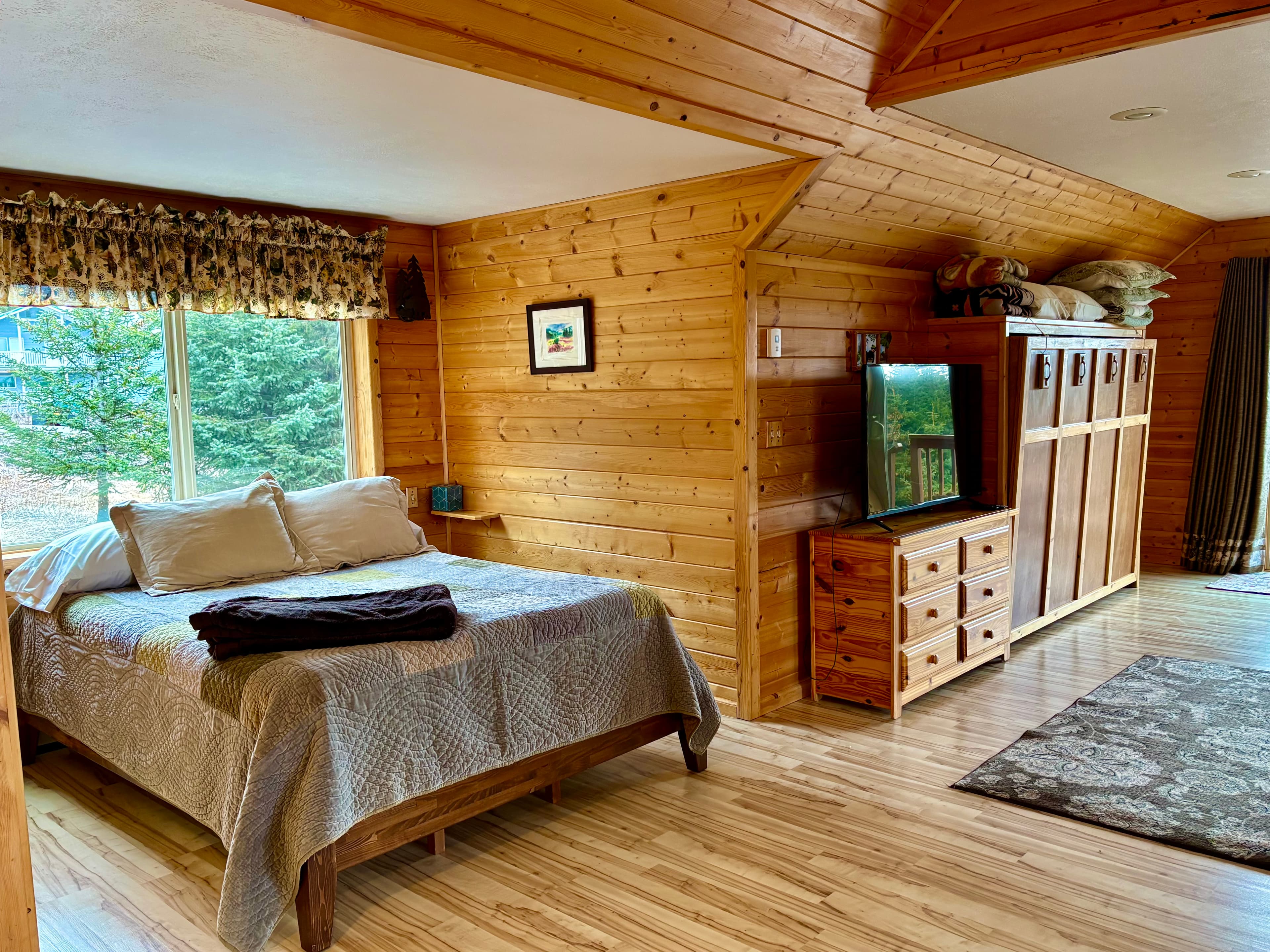 queen bed plus Murphy queen and large screen tv